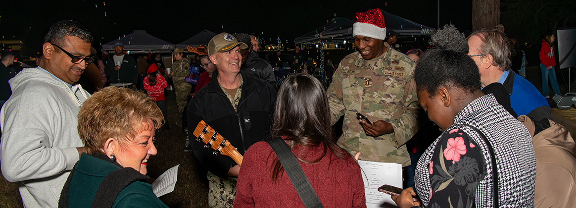 A photo of several people singing.